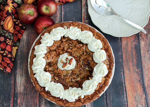 A decorated maple apple pecan pie.