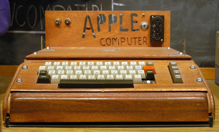 A fully assembled Apple I computer with a homemade wooden computer case.