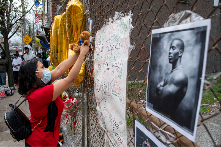 A fan hangs a teddy bear as a tribute at a makeshift memorial for musician and actor DMX outside White Plains Hospital, after he died at the age of 50 in White Plains, New York, US on April 9 2021.