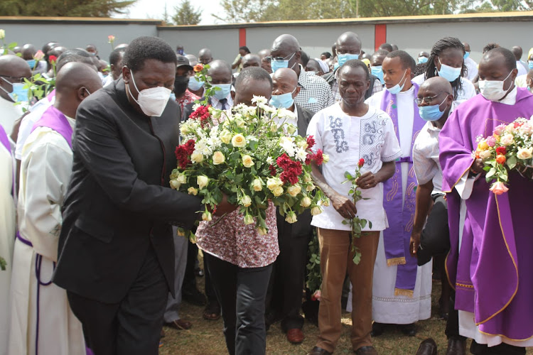 Defence cabinet secretary Eugene Wamalwa and Former Rift Valley regional commissioner George Natembeya jointly lay wreath on the grave of the departed Kapkoi Parish Priest Father Francis Xavier Opondo at the Bikeke Catholic Church on February 3, 2022.