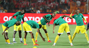 Marvellous Nakamba, (l) Divine Lunga and Ovidy Karuru of Zimbabwe warm up during the 2019 Africa Cup of Nations Finals match between Egypt and Zimbabwe at Cairo International Stadium, Cairo, Egypt on 21 June 2019.