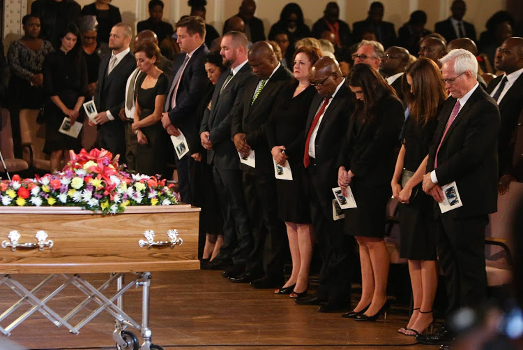 Former president Jacob Zuma stands with Gavin Watson's family at Watson's funeral in Port Elizabeth on Tuesday.