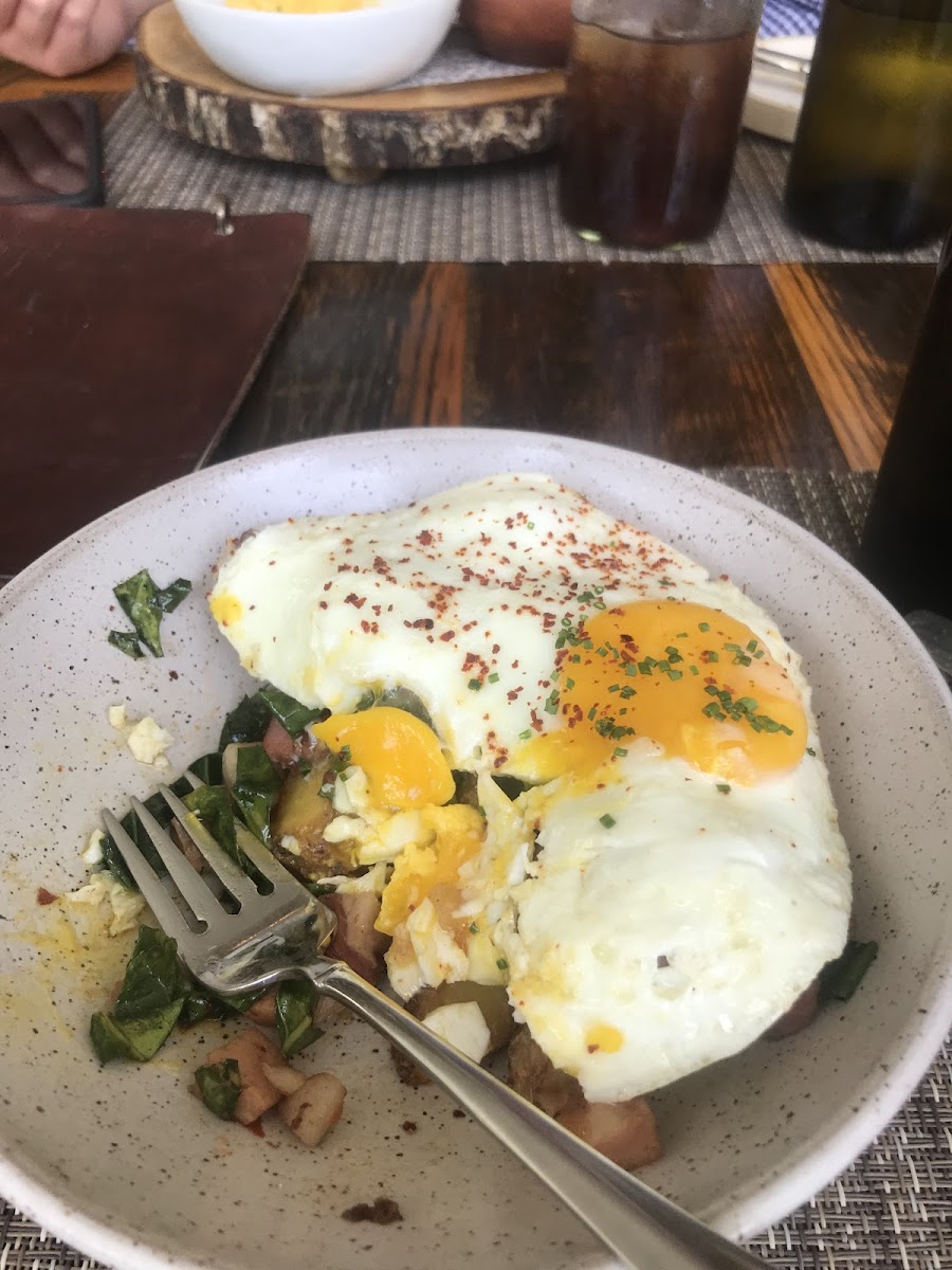Pork belly hash with collard greens and perfectly cooked eggs.