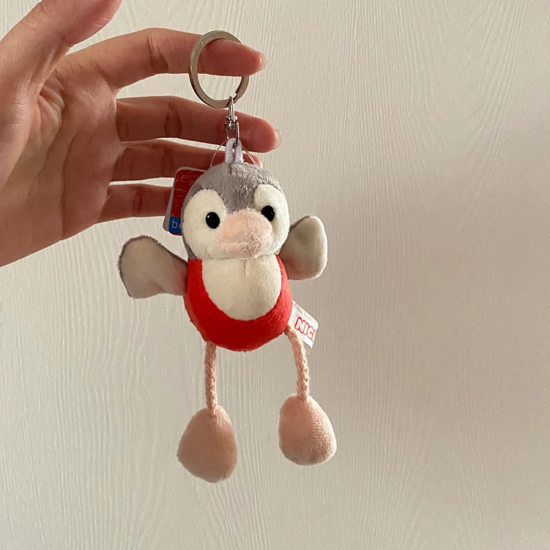 Sevimli Küçük Beyaz Koyun Peluş Kolye Ucu. Anahtarlar, sırt çantaları veya sevimli bir hediye için ideal. Şimdi satın alın!
