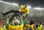 Baroka FC players celebrate their win by throwing head coach Witson Nyirenda in the air after their Telkom Knockout final match against Orlando Pirates in Port Elizabeth in December 2018.