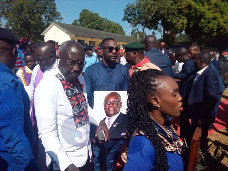 Prof George Magoha's son Michael Magoha leads a procession as the late former education Minister's body is ferried to Maseno University for the funeral ceremony on February 11, 2023.