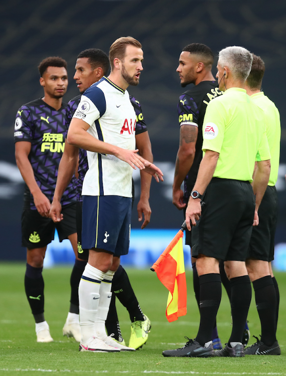 Tottenham Hotspur's Harry Kane speaks with referee Peter Bankes and his officials after the match
