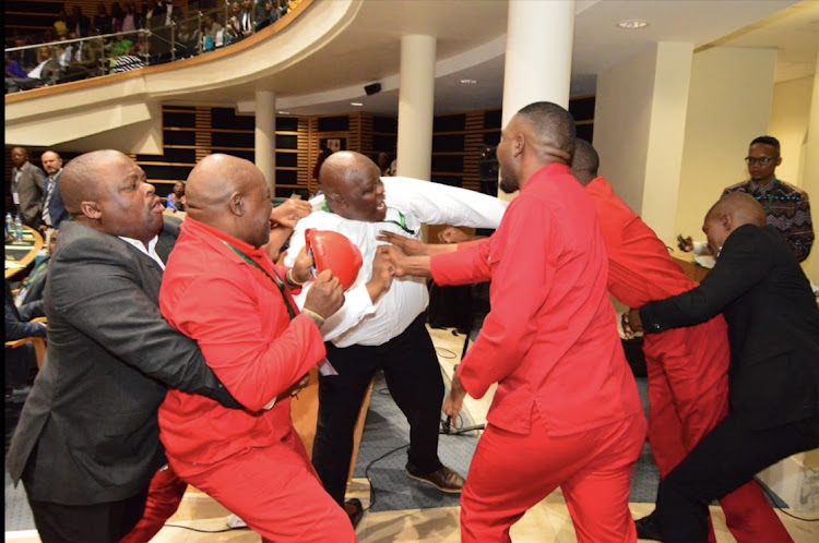 EFF members were unceremoniously removed from the Eastern Cape provincial legislature ahead of premier Oscar Mabuyane's State of the Province Address after complaints that they were inappropriately dressed in their trademark red overalls.