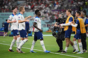 Bukayo Saka of England celebrates with teammates after scoring their fourth goal in their Fifa World Cup Qatar 2022 Group B match against Iran at Khalifa International Stadium in Doha on November 21 2022.