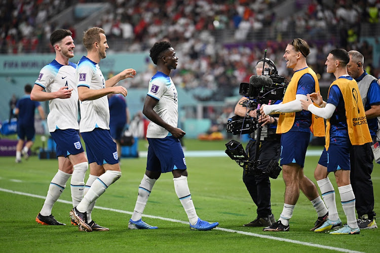 Bukayo Saka of England celebrates with teammates after scoring their fourth goal in their Fifa World Cup Qatar 2022 Group B match against Iran at Khalifa International Stadium in Doha on November 21 2022.