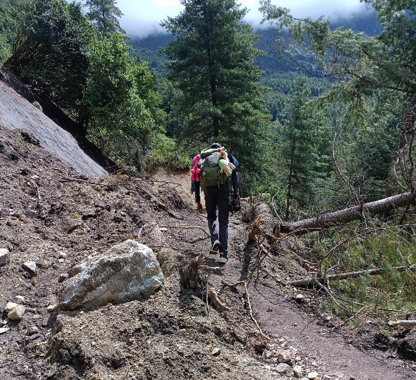 Cheruiyot Kirui's counterpart James Muhia climbing a mountain during a past hike