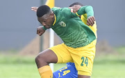 Sibusiso Vlakazi of Mamelodi Sundowns and Nqobeko Dlamini of Lamontville Golden Arrows compete for the ball. 