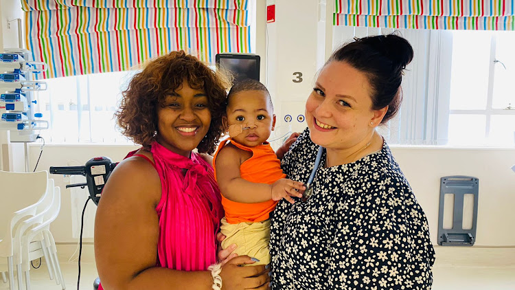 Gogo Skhotheni with her son and Dr Flack in hospital.