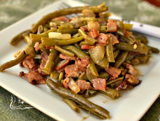 Southern Green Beans are slow cooked string beans combined with onion, garlic and crisp bacon