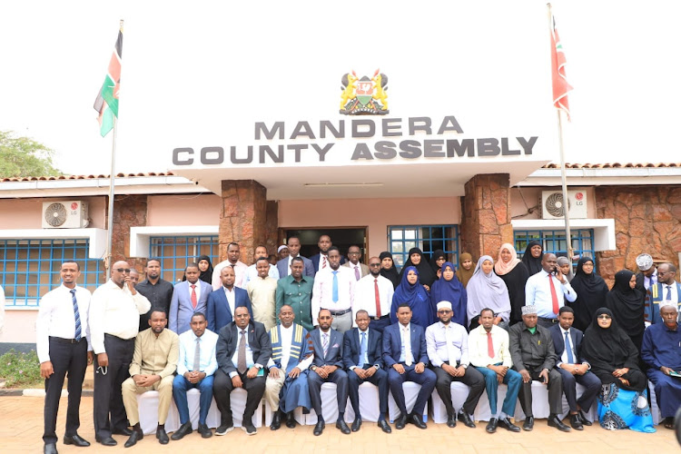 Mandera Governor Mohamed Adan Khalif [centre] with MCAs on October 11 after officially opening the county Assembly.