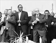 A victorious ANC president Jacob Zuma addresses his supporters outside the Pietermaritzburg High Court after Judge Cris Nicholson dismissed the NPA's case. Jacob Zuma dancing along from left  Julius MAlema, Blade Nzimande, Zwelinzima Vavi and Gwede Mantashe pic: SIMPHIWE NKWALI/ 12/09/008