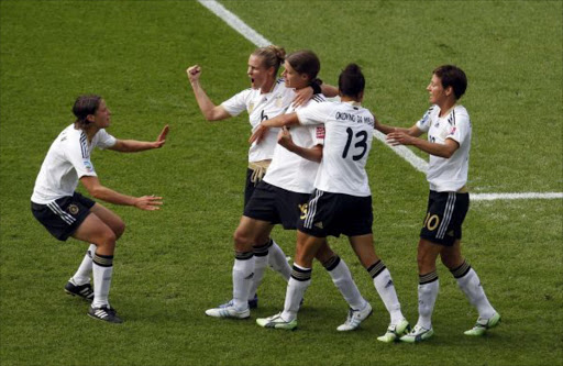 German players celebrate the goal of team mate Kerstin Garefrekes against Canada during the Women's World Cup Group A soccer match in Berlin June 26, 2011