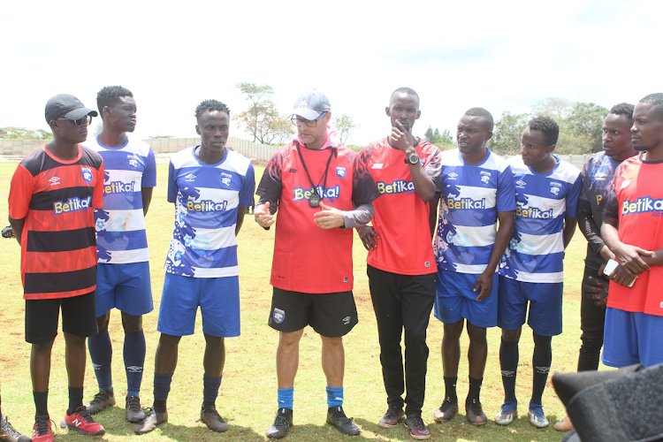 AFC Leopards players with their newly appointed coach Tomas Trucha at their training ground