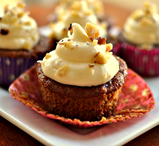 A family and friend favorite carrot cupcake recipe with crushed pineapple and chopped walnuts.  They are topped with a delectable four ingredient white chocolate cream cheese frosting.