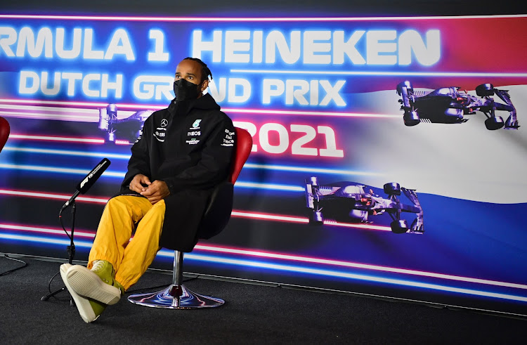 Provocative: Lewis Hamilton arrived at Zandvoort, the Netherlands, on Thursday wearing an orange outfit in an apparent riposte to the fans of Max Verstappen, his main rival for this year's F1 title. Picture: REUTERS