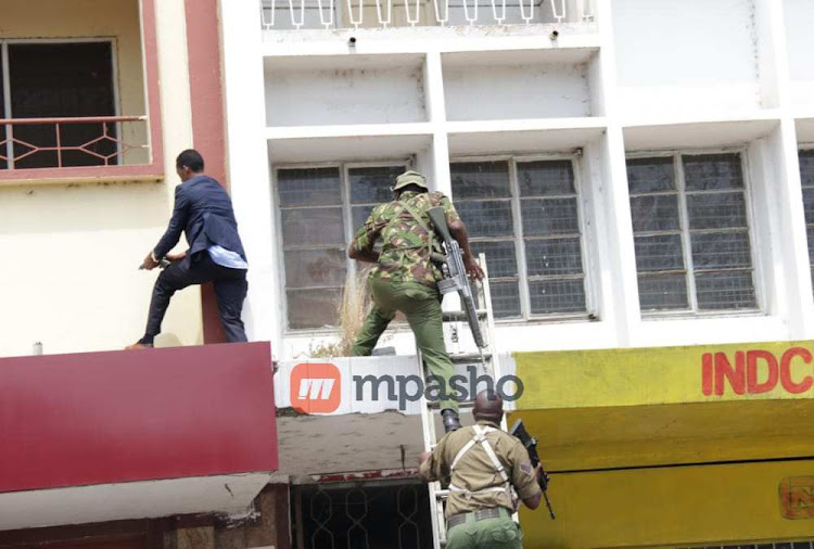 Police offers making entry into Equity bank as they intensify search at the building.