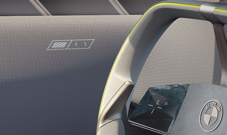 BMW’s ‘Shy Tech’ means even door opening controls can be hidden in the material until they light up on request.
