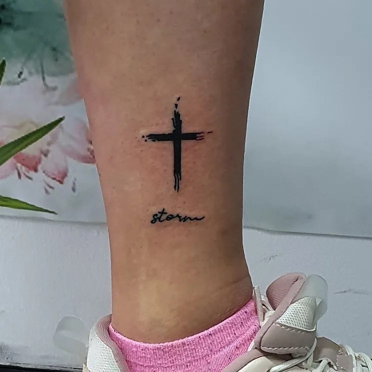 Cross tattoo with text