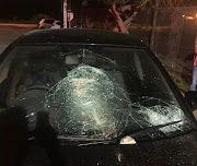 Some of the private and metro police vehicles damaged outside the hall in Colchester. 