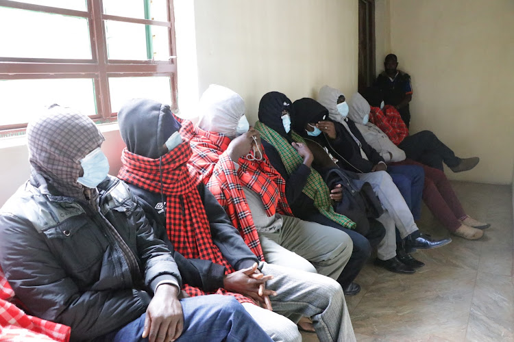 Nine police officers accused of the disappearance of the two Indian men and a taxi driver appear in Kahawa law courts on November 10, 2022.