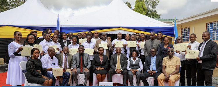 Photo: Graduands pose for a photo after their graduation on Thursday at Wote, Makueni County.