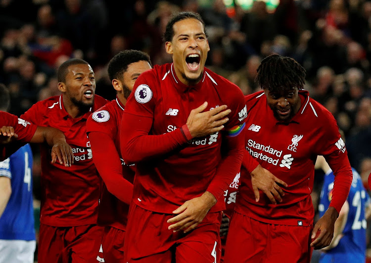 Liverpool's Virgil van Dijk celebrates with team mates during a recent match