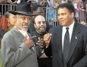 OLD FOES: Boxers Joe Frazier, left, and Muhammad Ali pose together as they arrive at the 10th annual ESPY Awards which honour excellence in all sports in Hollywood in this file photo. 
      Photo: Reuters