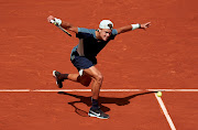 Holger Rune of Denmark returns against Stefanos Tsitsipas of Greece in their French Open fourth round match at Roland Garros on May 30 2022.