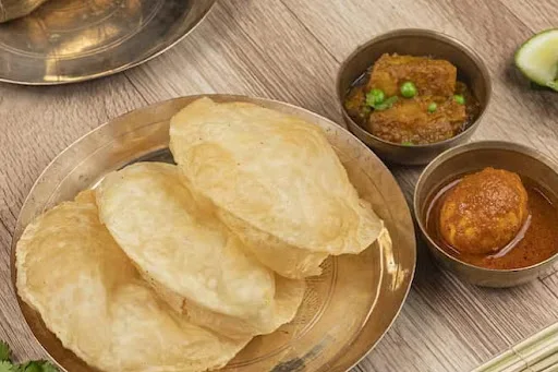 Luchi [4 Pieces] With Aloo Dum [2 Pieces] & Egg Kosha [1 Piece]