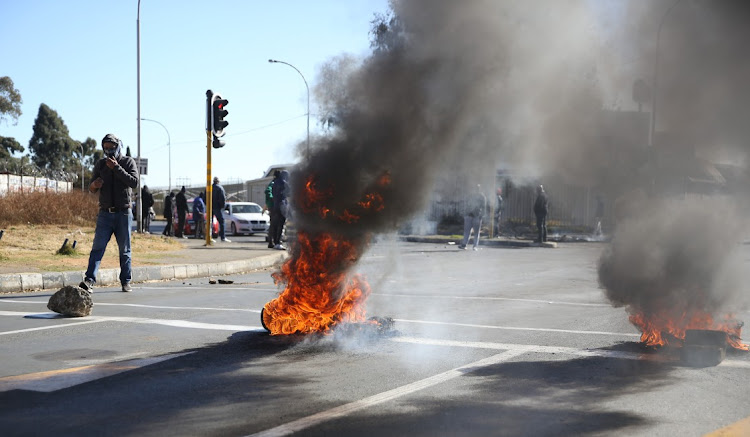 Residents of the Riverlea block Main reef Road in Johannesburg protesting against illegal miners in the area.
