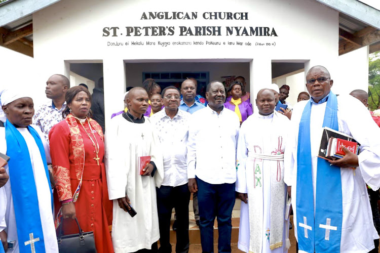 Raila Odinga with Siaya Governor James Orengo at Anglican Church in Bondo, December 25.