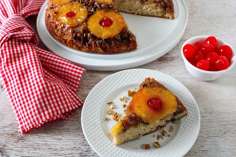 A Slice Of Iron Skillet Pineapple Upside Down Cake On A Plate.