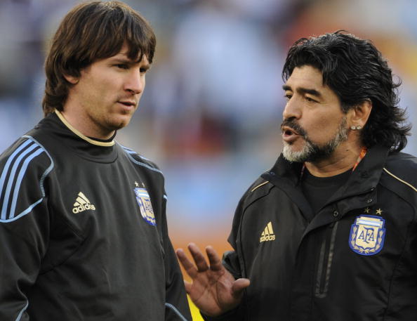 The late former Argentina coach Diego Maradona (R) speaks to star striker Lionel Messi before the 2010 World Cup quarterfinal match against Germany on July 3, 2010 at Green Point stadium in Cape Town.