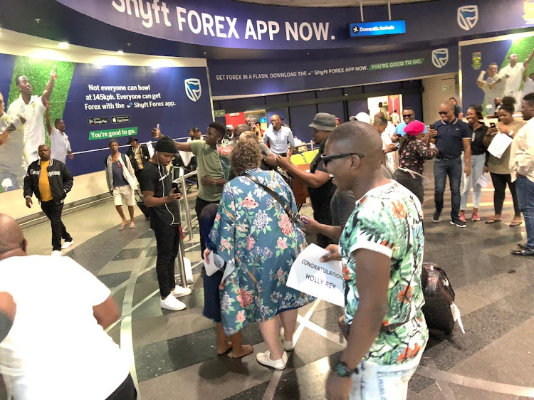 Friends, family and fans were at Durban's King Shaka International Airport to welcome Holly Rey home.