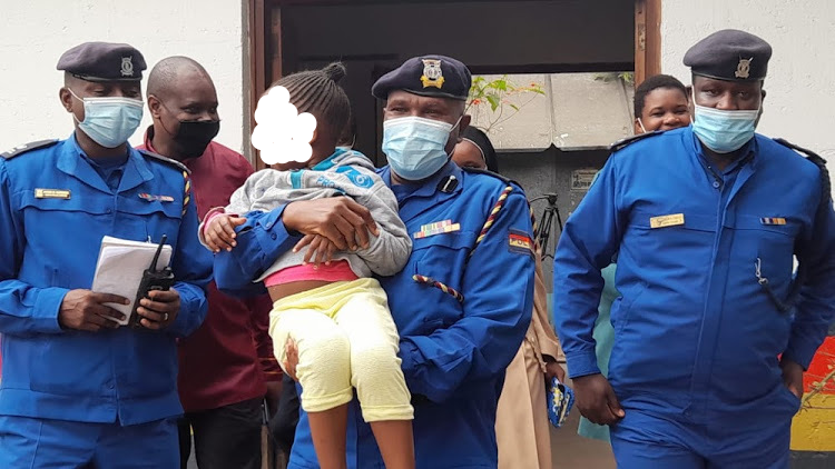 Embakasi subcounty police commander Francis Ngugi with a child, who was rescued on June 16, 2021.