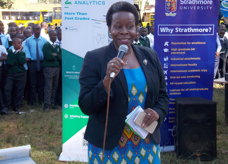 Embu education Executive Dr Joan Mwende speaking at Kangaru High School during a Mathematics constest sponsored by Brookeside Dairy Co.