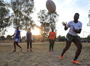 Members of the Zimbiru Rugby Academy Club, an all-female rugby team take part in a training session at Zimbiru Primary School in Domboshava outside Harare, Zimbabwe.