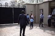 Private security at the compound initially refused to let the authorities in, but that they later relented.