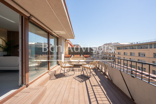Buy this luxury apartment in Barcelona (Spain) - Wooden terrace with garden furniture