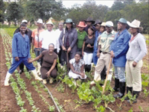 FRESH START:MEC Khabisi Mosunkutu, in white shirt, with beneficiaries and Jo'burg Fresh Produce Market management. 01/02/09. Pic. Penwell Dlamini. © Sowetan.