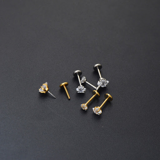 Title 4, Round Four-Claw Flat Ear Studs. Daily elegance,...