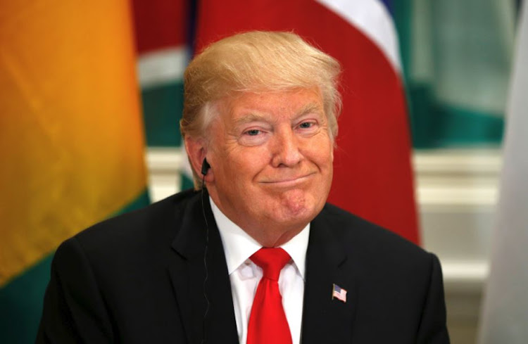 US President Donald Trump smiles while hosting a working lunch with African leaders during the UN General Assembly in New York, US, September 20, 2017.