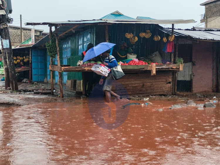 Nairobi Resident braving the rain