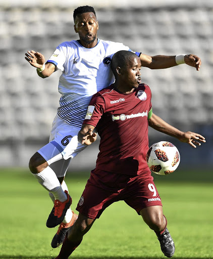 Lebohang Mokoena of Swallows shields the ball from Manti Mekoa of Cape Umoya United at Athlone Stadium in Cape Town. United won 1-0. / Ashley Vlotman/gallo images