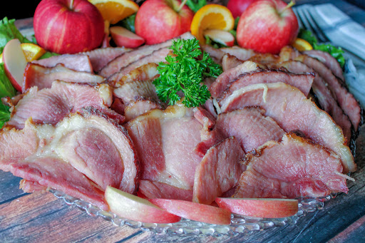 Kentucky bourbon glazed ham on a platter.